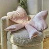 Coussin noeud XL en satin